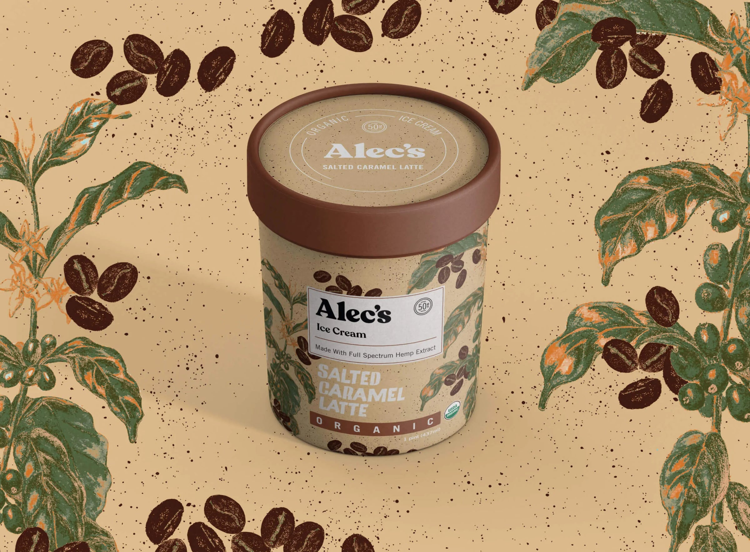 A container of Alec's Ice Cream with a coffee-themed design on a beige background with coffee beans and leaves.