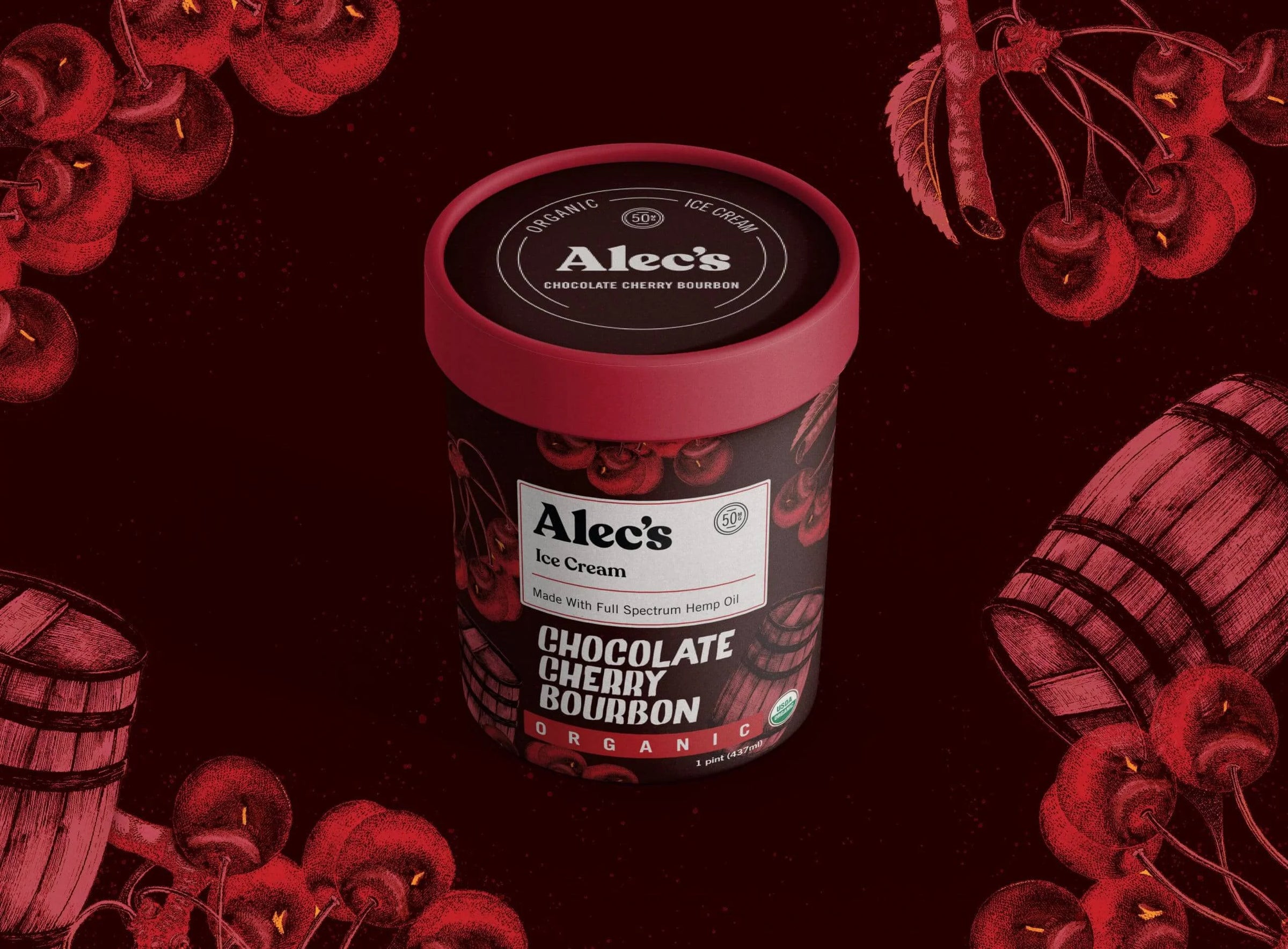 Container of Alec's Ice Cream with cherry and barrel design on a dark background
