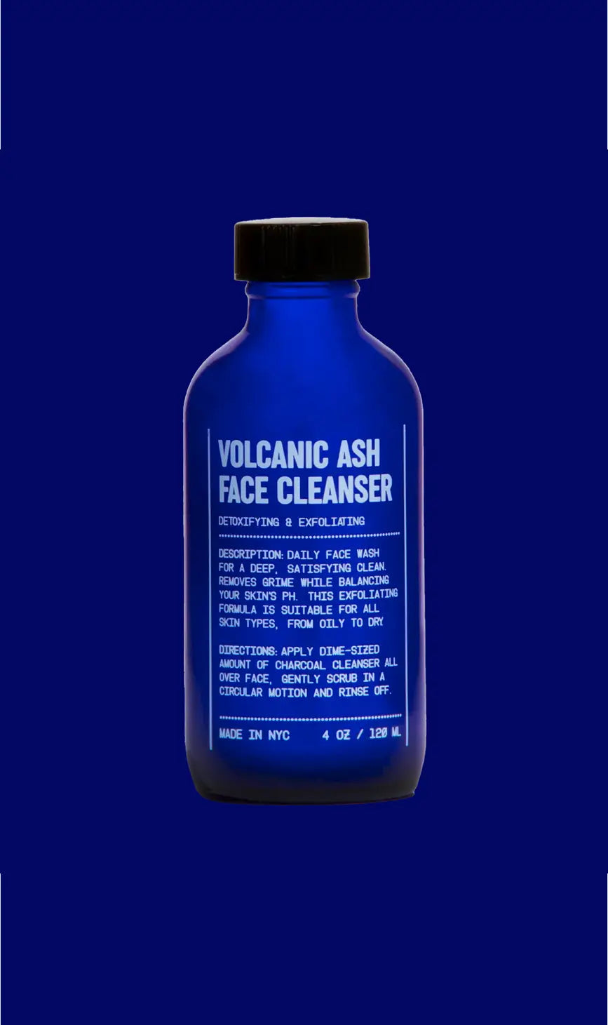 Blue bottle of blu atlas Volcanic Ash Face Cleanser on a blue background