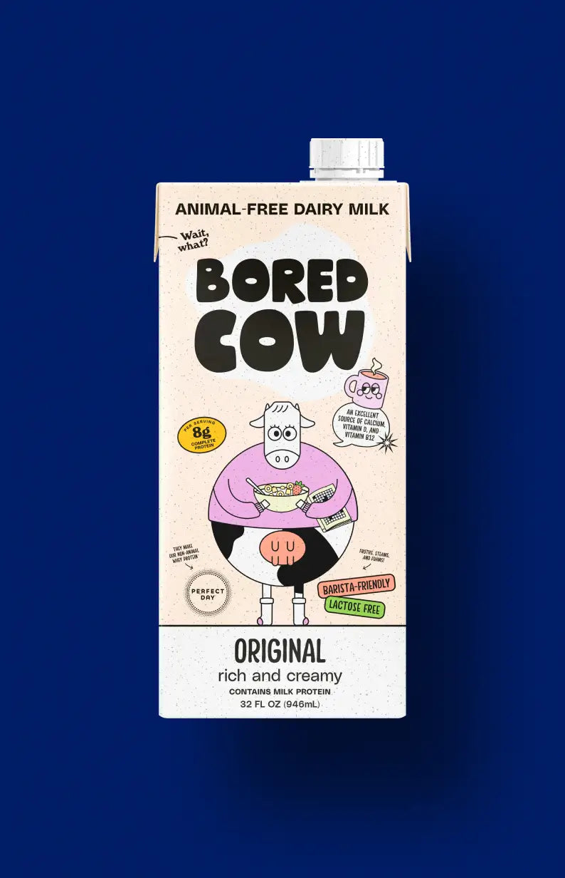 Carton of Bored Cow animal-free dairy milk on a blue background
