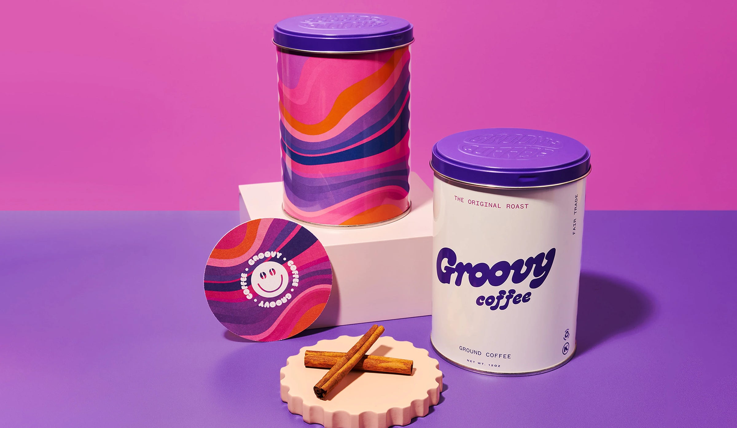 Groovy coffee canisters with colorful lids on a purple and pink gradient background