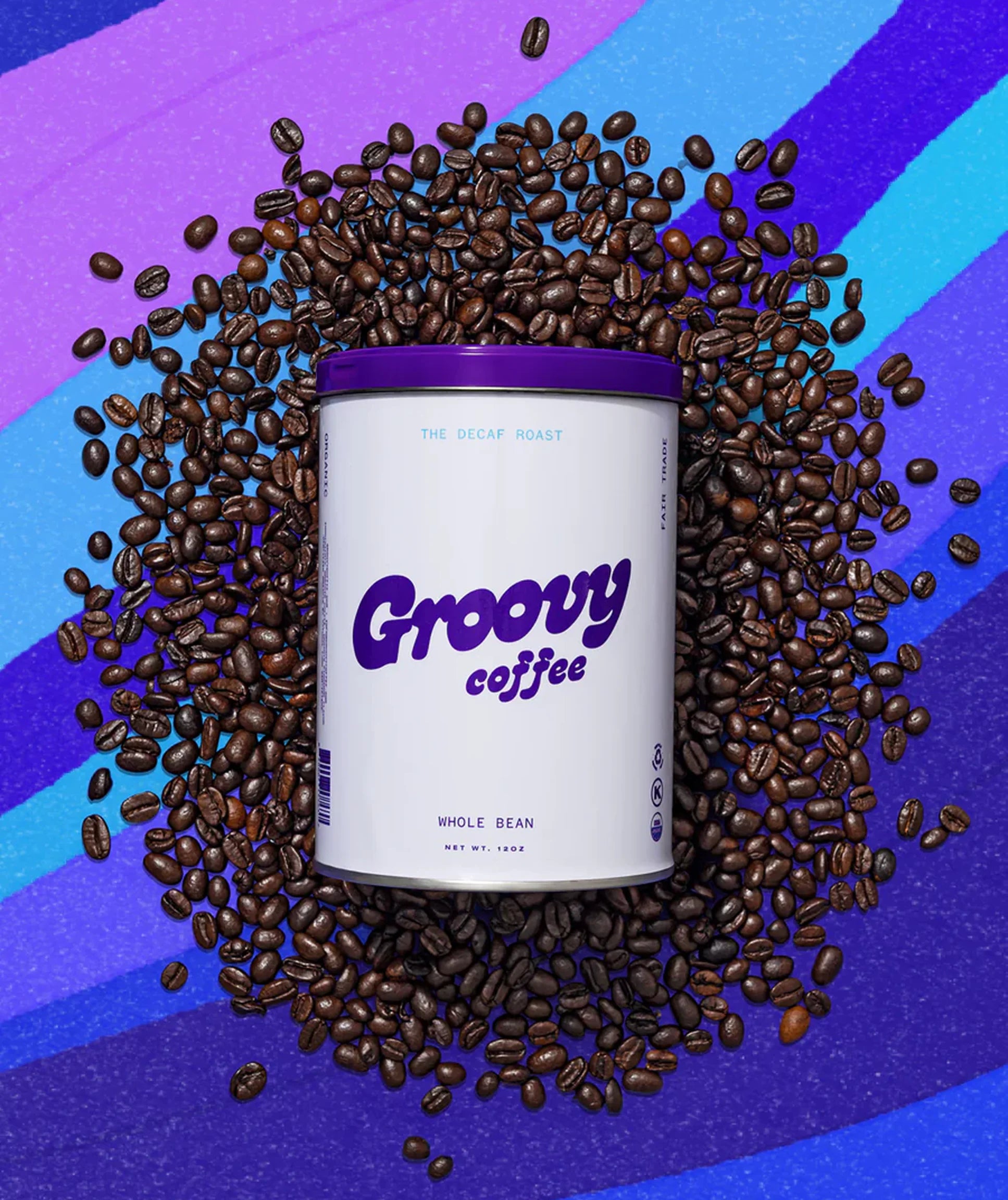 Groovy Coffee can surrounded by coffee beans on a colorful background