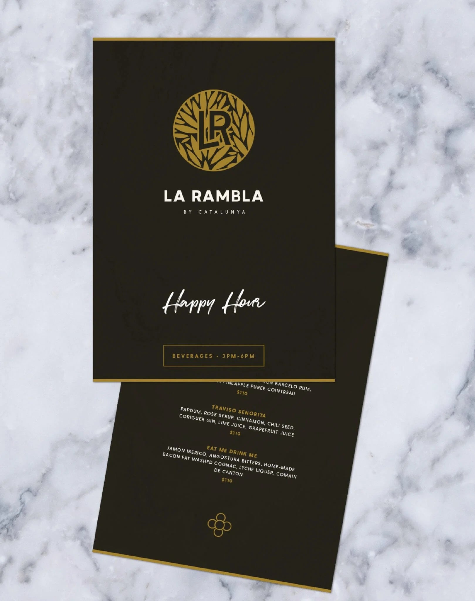 Black menu with gold text and La Rambla logo on a marble background