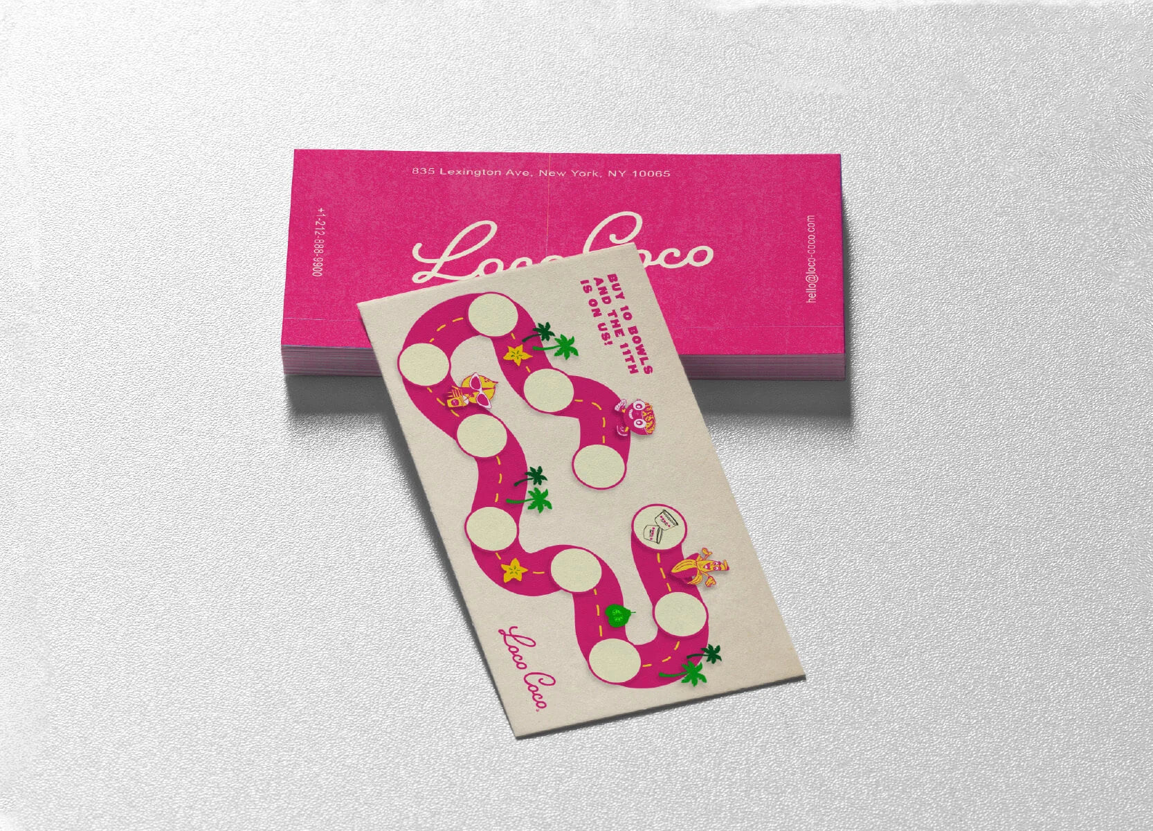 Sticker with pink and white design on a beige card, placed on a pink box with 'Looeys' branding.
