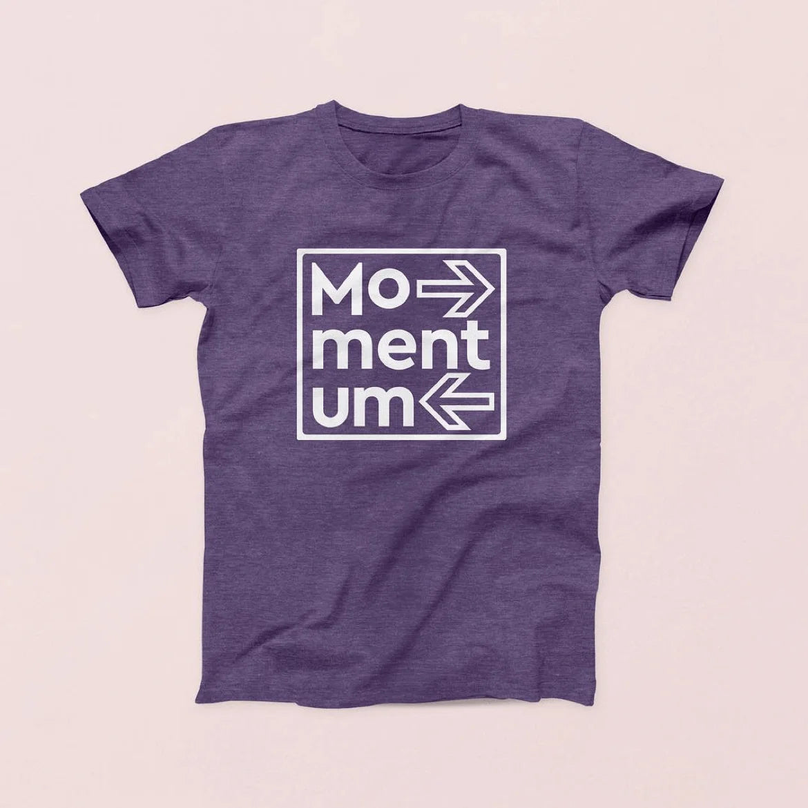 Purple t-shirt with 'Momentum' logo on a light pink background