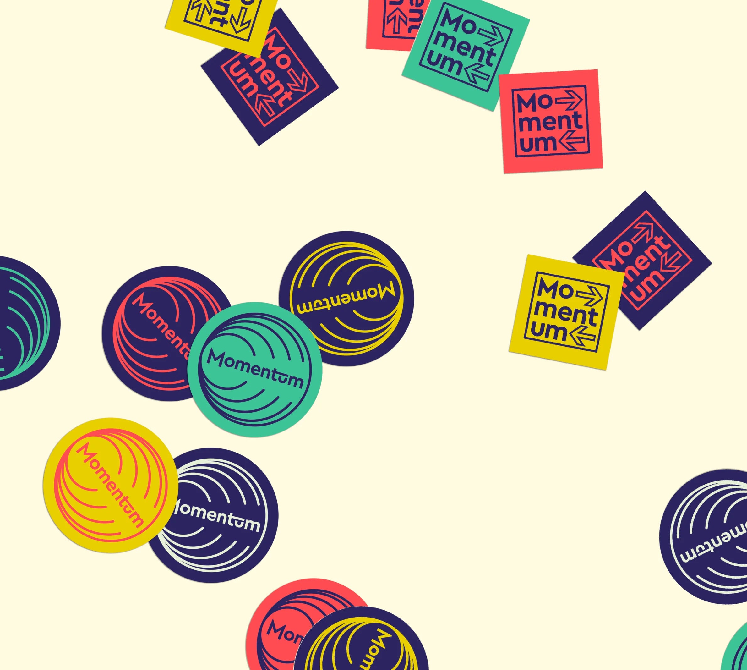 Colorful 'Momentum' logo stickers on a beige background
