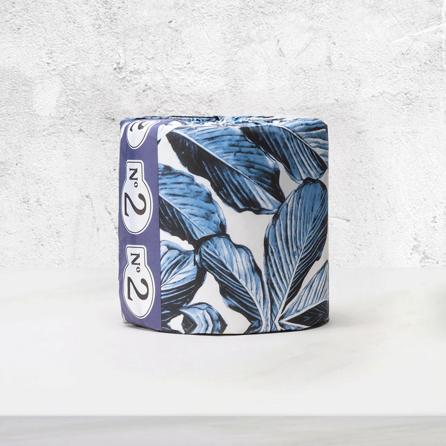 Toilet paper with blue leaf pattern on a white background