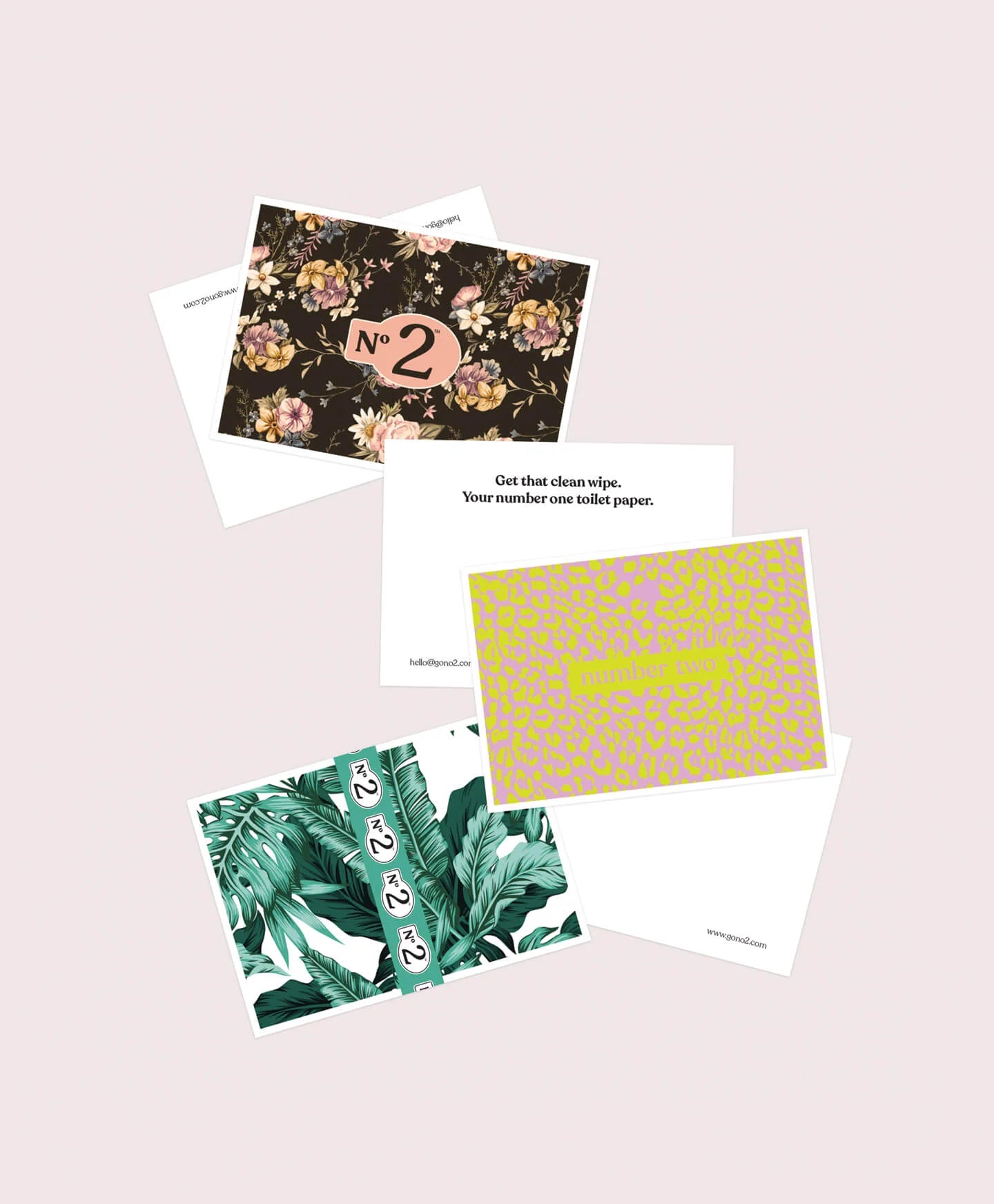 Collection of greeting cards with different designs on a light pink background