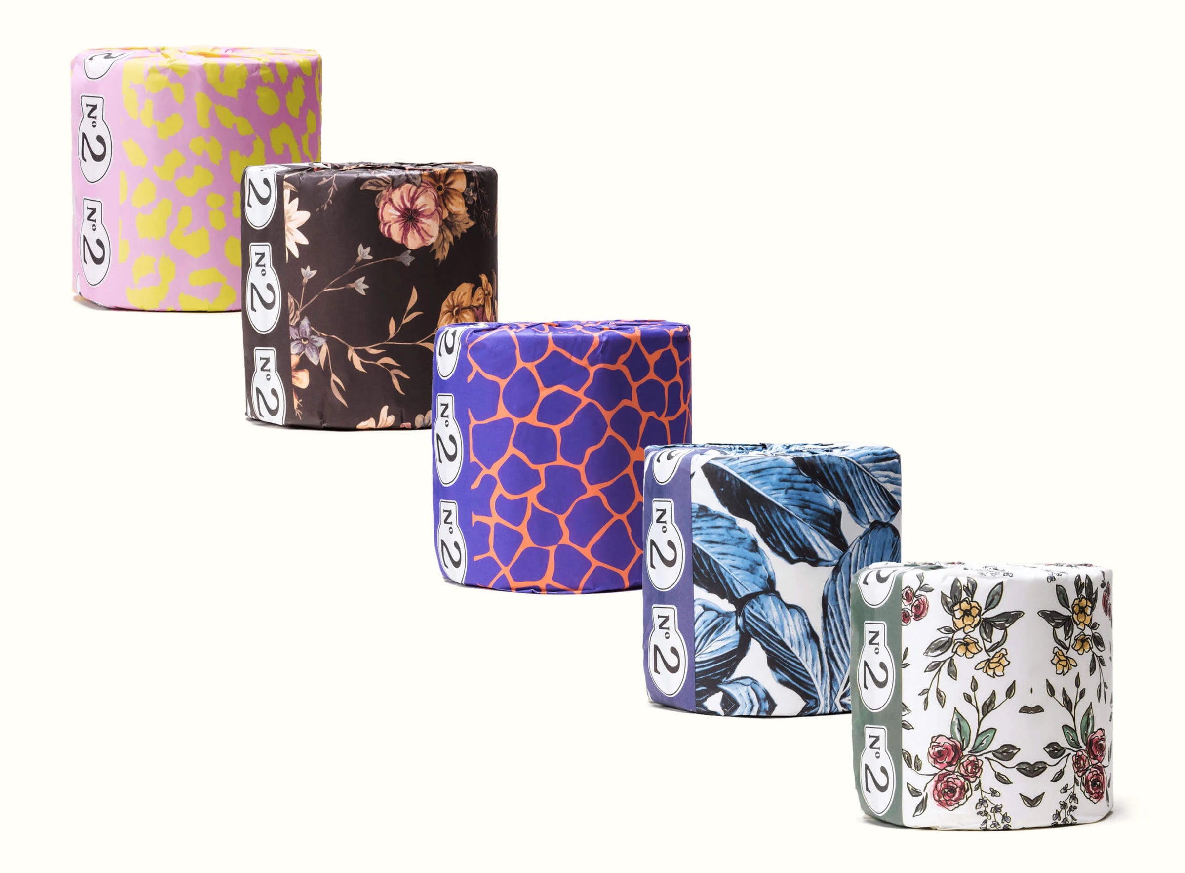 Set of colorful patterned toilet papers on a white background