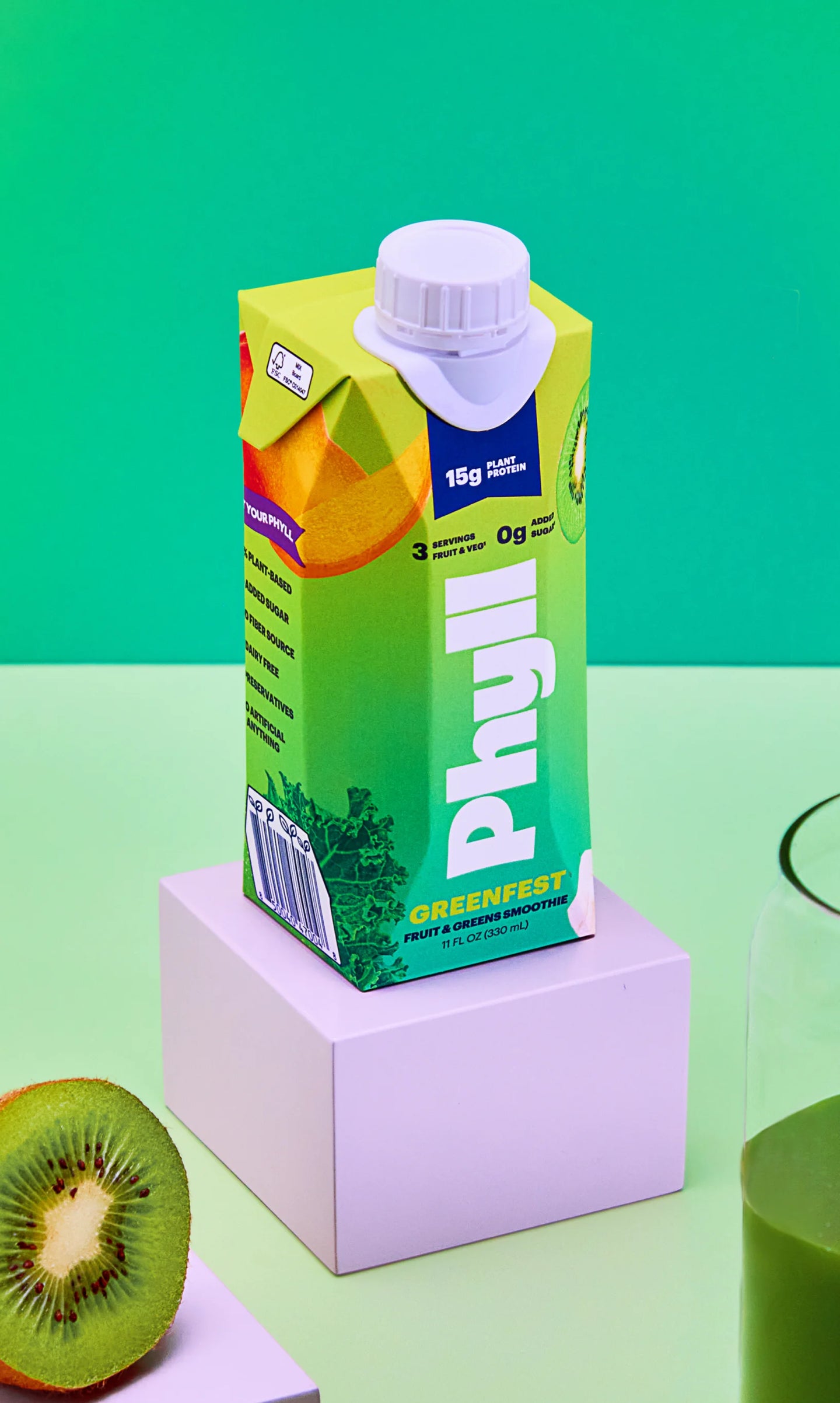 Green juice box with a white cap on a green background