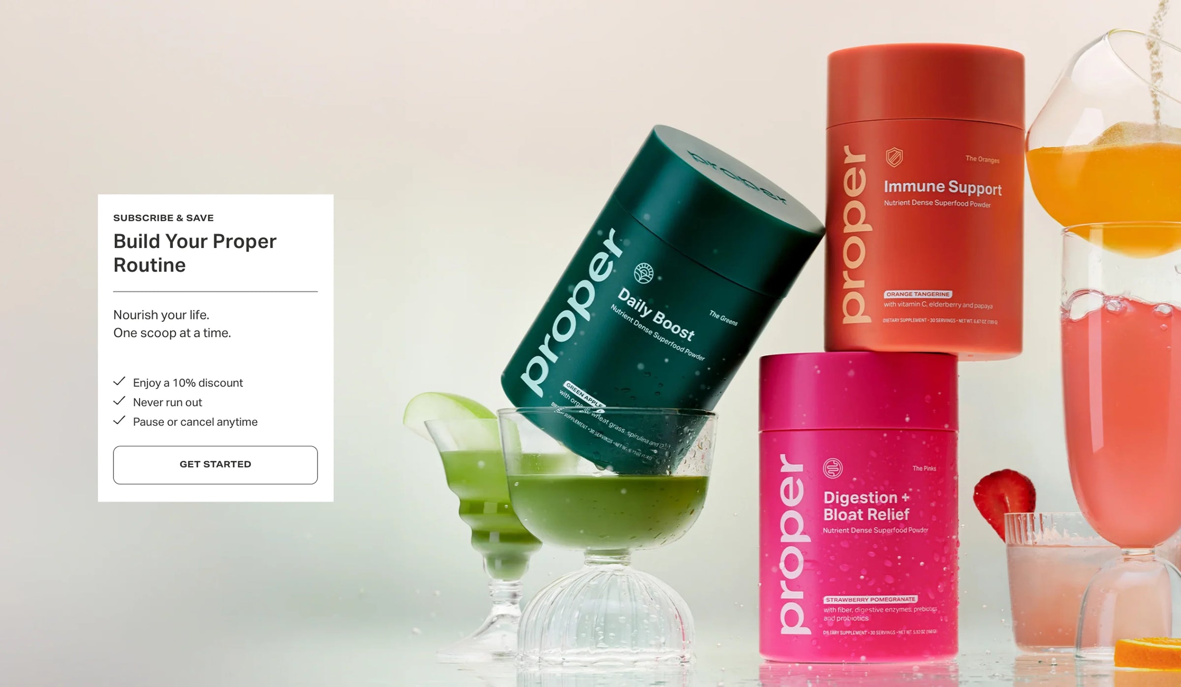 Proper brand supplement containers with drinks on a light background