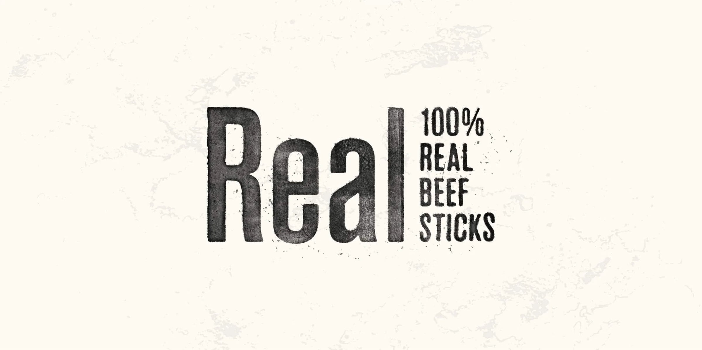 Black text on a white background stating 'Real 100% Real Beef Sticks'.