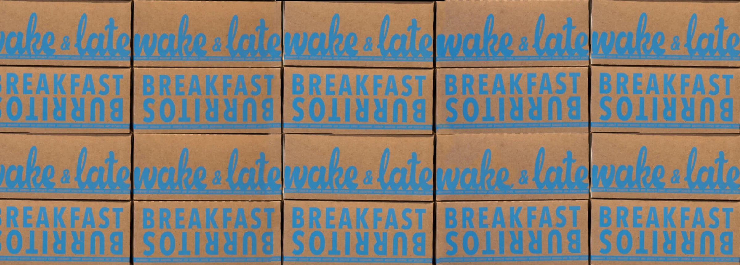 Multiple boxes of 'Wake & Late' breakfast burritos with blue text on a brown background.