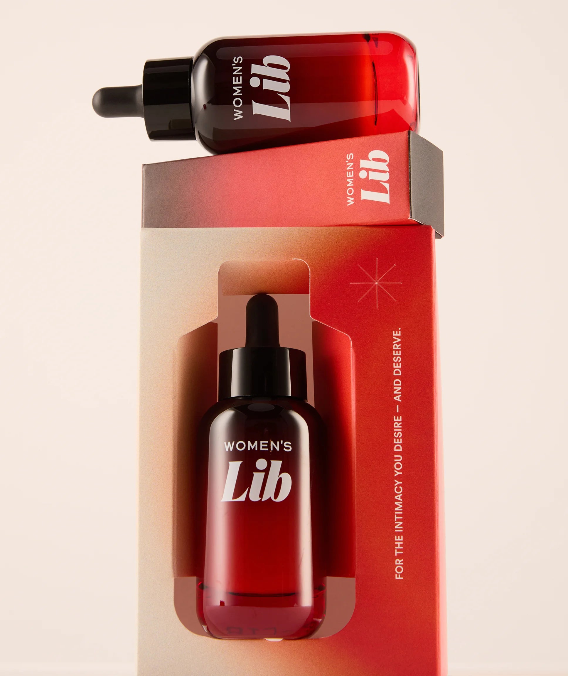 Bottle and packaging of 'Women's Lib' on a beige background